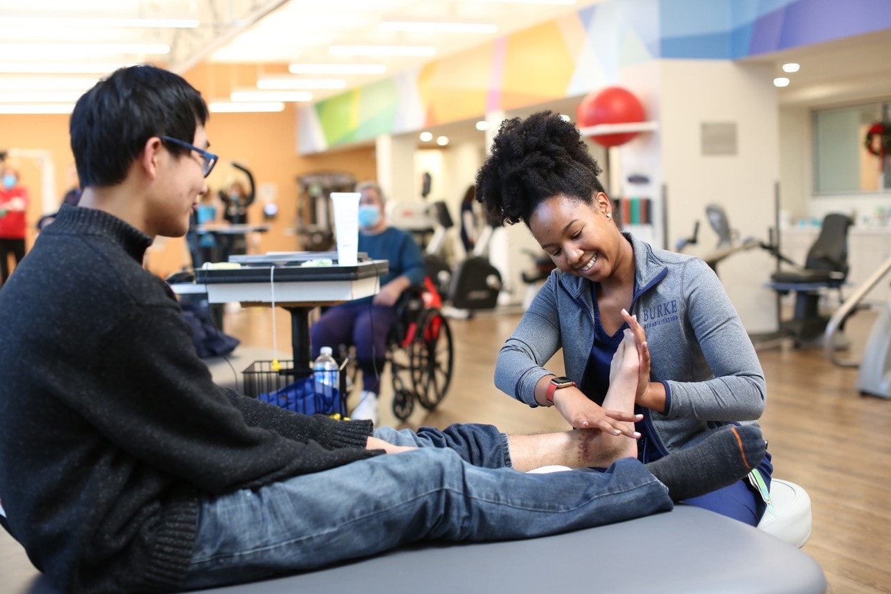 patient on table with therapist 