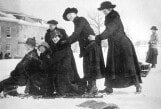 Archival black and white photo of female visitors to Burke sledding circa 1910s