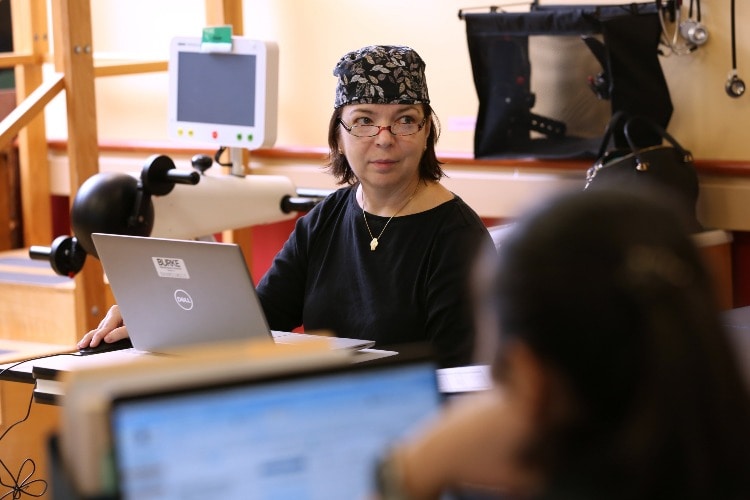 Doctor leading the therapy team meeting to discuss patient cases